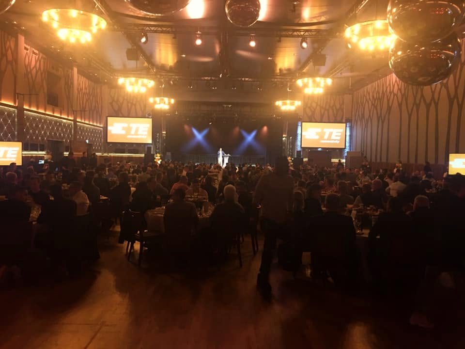 Performance at a large corporate gala before hundreds of guests